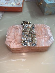 Emblished Onaxe marble Clutch