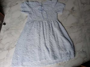 Light Blue Textured Dress With Bow Detailing