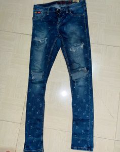Edgy Elegance Distressed Floral Skinny Jeans”