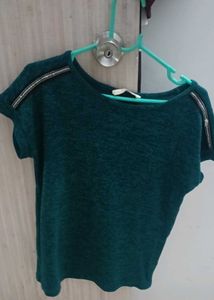 Green Top With Work On It&#39;s Shoulder