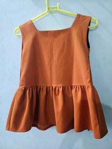 Tobia Orange Peplum Top