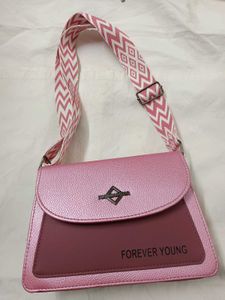 Brand New, never used pink leather crossbody bag
