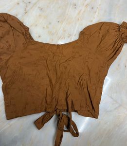 brown crop top with puffy sleeves