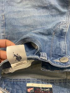 Light blue denim jeans with a cool distressed look