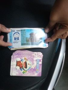The Combo Of Playing Bank Money And Doremon Cards