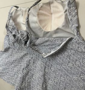Embroidered Peplum Top