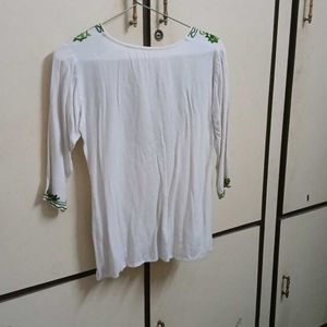 white chikankari kurti with green embroidery