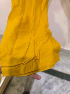 Mustard yellow churidar pant.