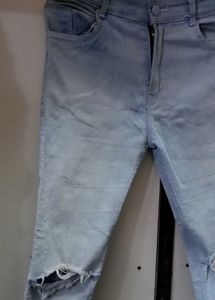 Ripped Knee Light Wash Jeans