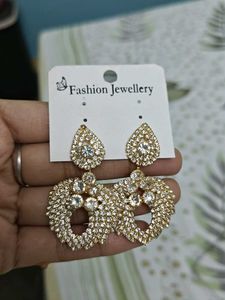 Silver Jhumka And Golden Diamond Earrings