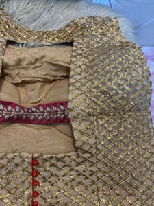 Backless golden choli