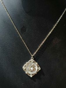 Silver Bow Pendant Necklace