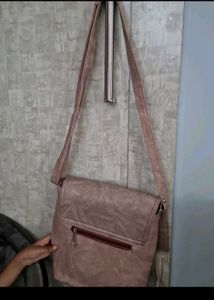 very cheap  beige coloured sling / crossbody bag
