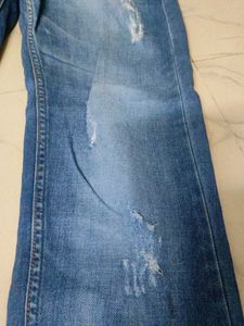 Distressed Blue Denim Jeans