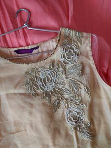 Srishti Peachy Golden Gown