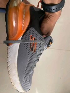 Walk comfortably in grey Skechers