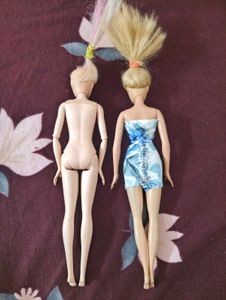 Two used barbie dolls