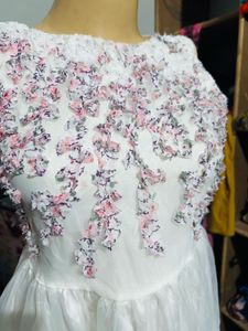 White dress with floral embroidery