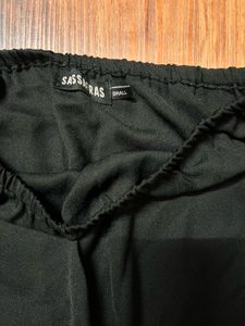 This sleek and stylish off-shoulder tube jumpsuit