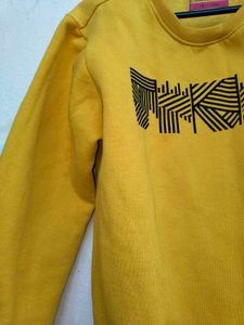 yellow pullover for men and women winter wear.