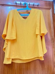 Yellow Stylish Top With Attached Cape