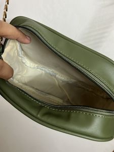 Party Wear Green Sling With Metal Chain Detail