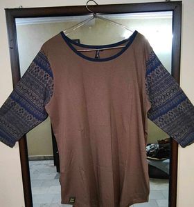Brown T-shirt with Patterned Blue SleevesCita