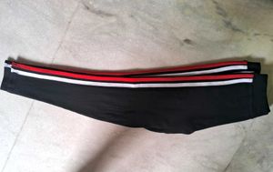 Black active wear with red and white stripe