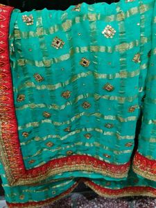 Green Colour Saree With red Lace and Kundan Work On It