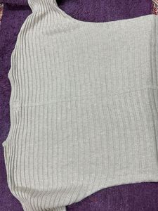 Gold–beige shimmer top.