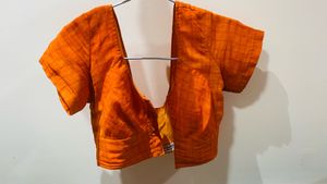 Orange sari with stitched blouse