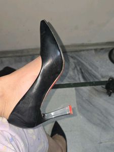 used red bottom black pointed heels