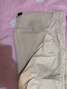 Beige parachute trousers