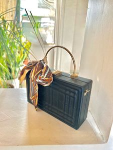 Structured Black Sling Bag with Golden Straps