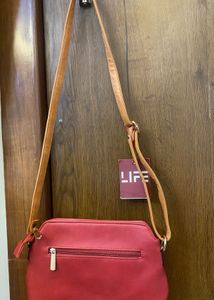 Woman’s Cherry Colored Bag