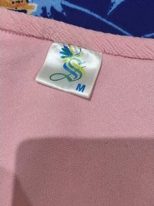a pink top