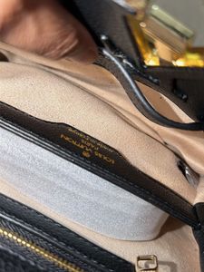 Louis Vuitton Capucine Handbag with sling belt