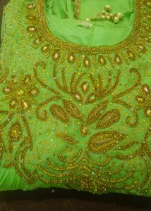 Elegant Green Embroidered Dress with Gold Detailin
