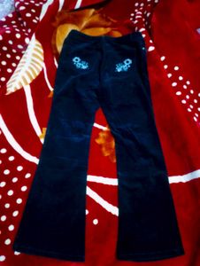 Black Coloured Bootcut Jean With Embroidery On It.