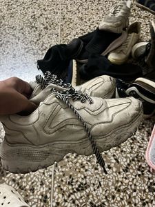 very used white sneakers