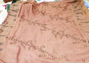 Rust colour saree with tie and die beautiful embroidery...pure georgette  saree