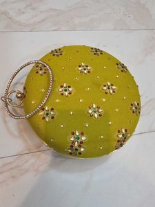 Mustard round Embroidered Clutch