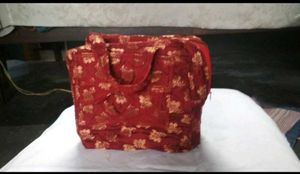 Haath Se Bana Lal Phoolon Wala Potli Bag - Eleganc