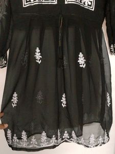 A Short Chikankari Kurti In Black Colour