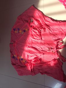 pink stretchy top with flowers embodery
