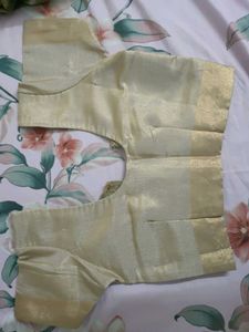 Elegant Mustard Saree with Gold Details