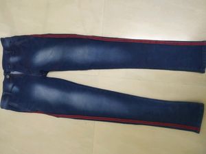 Blue Jeans With Two Red Stripes On Sides