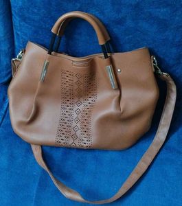 Brown Bag With Cutwork Design In Front