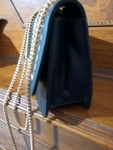 spacious black sling bag