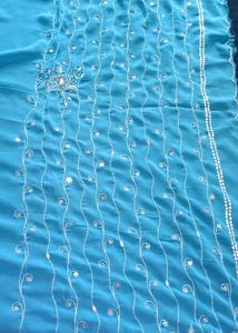 A Sky Blue Georgette Sequins Saree